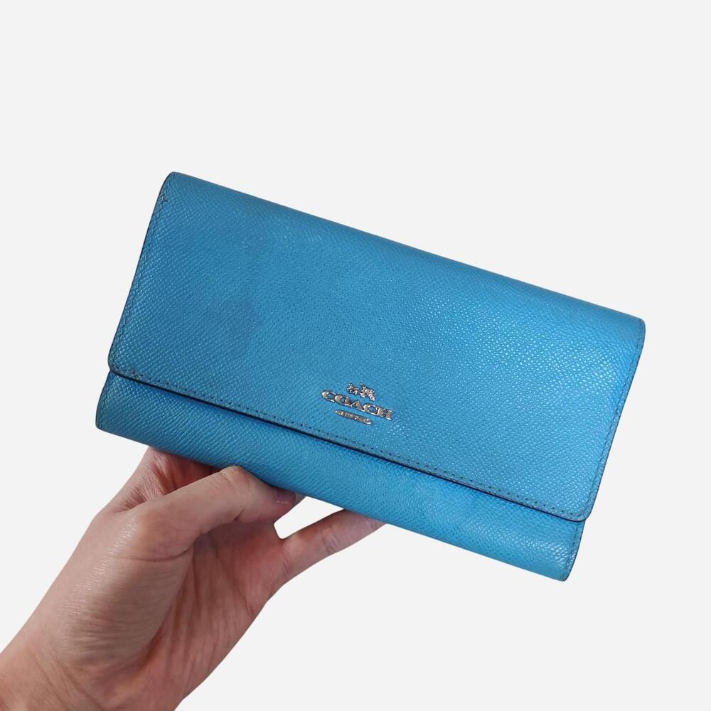 Coach blue leather wallet with textured surface